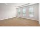 Spacious bedroom with three large windows allowing for plenty of natural light at 3658 Madison St, College Park, GA 30337
