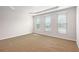 Spacious bedroom with large windows and tray ceiling at 3658 Madison St, College Park, GA 30337