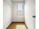 Walk-in closet with neutral carpeting, and a window for natural light at 3658 Madison St, College Park, GA 30337