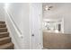 Welcoming entryway with staircase leading to open-concept living space and kitchen at 3658 Madison St, College Park, GA 30337