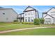 Lovely two-story home showcasing a lush green lawn and attractive landscaping at 3658 Madison St, College Park, GA 30337