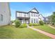 Beautiful home featuring a lush lawn and a charming brick walkway to the front door at 3658 Madison St, College Park, GA 30337