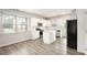 Modern kitchen featuring white cabinets, granite counters, and stainless steel appliances at 3658 Madison St, College Park, GA 30337