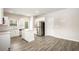 Bright kitchen with stainless steel appliances, a center island, and hardwood floors at 3658 Madison St, College Park, GA 30337