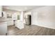 Modern kitchen featuring stainless steel appliances, island, and stylish flooring at 3658 Madison St, College Park, GA 30337