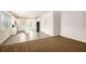 Well-lit kitchen featuring an island, sleek appliances, and hardwood flooring at 3658 Madison St, College Park, GA 30337