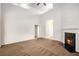 Spacious living room with high ceilings, fireplace, and seamless flow to other areas at 3658 Madison St, College Park, GA 30337