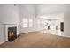 Cozy living room with fireplace connecting to the bright and modern kitchen at 3658 Madison St, College Park, GA 30337