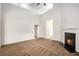 Spacious living room with fireplace, neutral carpet, and high ceilings at 3658 Madison St, College Park, GA 30337