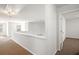 Upstairs loft area featuring neutral carpeting, ceiling fan and plenty of natural light through bright windows at 3658 Madison St, College Park, GA 30337