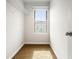 A walk-in closet area is light and bright with a window and shelves at 3658 Madison St, College Park, GA 30337