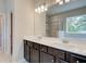 Bright bathroom features a double vanity, large tub, and glass shower with tile surround at 4554 Eastbrook Pl, Snellville, GA 30039