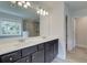 Bright bathroom features a double vanity, large tub, and glass shower with tile surround at 4554 Eastbrook Pl, Snellville, GA 30039