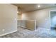 Loft space with neutral walls, plush carpeting and hallway entrance at 4554 Eastbrook Pl, Snellville, GA 30039