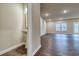 Open living space with luxury vinyl plank flooring, recessed lighting, and a view to the outdoors at 4554 Eastbrook Pl, Snellville, GA 30039