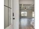 Bright living room featuring hardwood floors, coffered ceilings, and a ceiling fan at 4554 Eastbrook Pl, Snellville, GA 30039