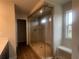 Spacious main bathroom with a glass shower enclosure and tiled bench at 4554 Eastbrook Pl, Snellville, GA 30039