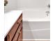 A close up of a bright bathtub with fixtures and a white countertop at 2555 Flat Shoals Road Rd # 1104, College Park, GA 30349