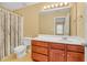 A bathroom featuring a vanity with cabinets, a shower-tub combo, and neutral paint at 2555 Flat Shoals Road Rd # 1104, College Park, GA 30349