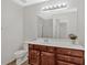 Bathroom features a large mirror and a wood cabinet beneath a white countertop at 2555 Flat Shoals Road Rd # 1104, College Park, GA 30349