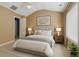 A staged bedroom with vaulted ceiling features a ceiling fan, a window, and neutral paint at 2555 Flat Shoals Road Rd # 1104, College Park, GA 30349