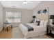 Charming bedroom featuring a tufted headboard, decorative lamps, and cozy throw at 2555 Flat Shoals Road Rd # 1104, College Park, GA 30349