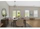 Bright dining room with wood floors, chandelier, and seating for six, perfect for Gathering meals and entertaining guests at 2555 Flat Shoals Road Rd # 1104, College Park, GA 30349