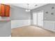 A dining room featuring fresh neutral paint, chair rail molding, and carpet floors at 2555 Flat Shoals Road Rd # 1104, College Park, GA 30349