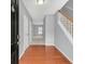Entryway featuring hardwood floors, a staircase with wood handrail, and fresh neutral paint at 2555 Flat Shoals Road Rd # 1104, College Park, GA 30349