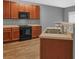 A kitchen featuring wood cabinets, a laminate countertop, a stainless steel sink, and a window at 2555 Flat Shoals Road Rd # 1104, College Park, GA 30349