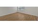 Spacious living room featuring sleek wood flooring and natural light from the window at 2555 Flat Shoals Road Rd # 1104, College Park, GA 30349
