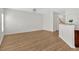 An open living room featuring a breakfast bar leading to the kitchen and modern flooring at 2555 Flat Shoals Road Rd # 1104, College Park, GA 30349
