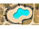 Aerial view of a kidney-shaped community pool with clear blue water and ample deck space at 2555 Flat Shoals Road Rd # 1104, College Park, GA 30349
