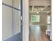 Inviting foyer with hardwood floors leading to a spacious living area with tray ceilings at 4524 Eastbrook Pl, Snellville, GA 30039