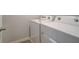Functional laundry room with a side-by-side washer and dryer set at 4524 Eastbrook Pl, Snellville, GA 30039