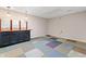 Finished basement featuring a bar area, colorful carpet tiles, and ample space at 4544 Dorsett Shoals Run, Douglasville, GA 30135