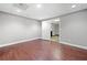 Finished basement featuring dark hardwood floors and modern lighting fixtures at 4544 Dorsett Shoals Run, Douglasville, GA 30135