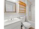 Bright bathroom showcasing vanity sink, toilet, and shower/tub combo at 4544 Dorsett Shoals Run, Douglasville, GA 30135