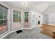 Bright breakfast nook featuring fireplace, large windows, and access to outdoor deck at 4544 Dorsett Shoals Run, Douglasville, GA 30135