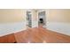 Open dining room featuring hardwood floors with view of kitchen, living room and modern lighting at 4544 Dorsett Shoals Run, Douglasville, GA 30135