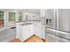 Modern kitchen features stainless steel appliances, breakfast bar, and hardwood floors at 4544 Dorsett Shoals Run, Douglasville, GA 30135