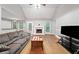 Spacious living room features a fireplace, hardwood floors, and vaulted ceilings at 4544 Dorsett Shoals Run, Douglasville, GA 30135