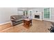 Bright living room boasting hardwood floors and a cozy fireplace, perfect for relaxing at 4544 Dorsett Shoals Run, Douglasville, GA 30135
