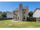 Fenced backyard with view of the home's rear exterior and patio at 752 Wood Bend Ct, Riverdale, GA 30296