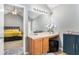 Bright bathroom with a vanity, sink and access to the main bedroom at 752 Wood Bend Ct, Riverdale, GA 30296