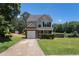 Charming two-story home featuring a brick facade, well-manicured lawn and attached garage at 752 Wood Bend Ct, Riverdale, GA 30296