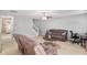 Cozy living room with neutral carpet, ceiling fan and comfortable sofas, perfect for Gathering gatherings at 752 Wood Bend Ct, Riverdale, GA 30296