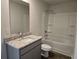 Bathroom features a granite countertop vanity, a toilet, and a shower/tub combo at 1669 Fuma Leaf Way, Mcdonough, GA 30253
