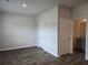 Spacious bedroom featuring hardwood floors, two closets, and an ensuite bath with granite countertop at 1669 Fuma Leaf Way, Mcdonough, GA 30253