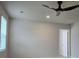 Bright bedroom with neutral walls, carpet, ceiling fan, and a doorway at 1669 Fuma Leaf Way, Mcdonough, GA 30253